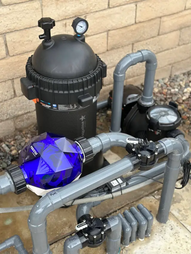 A PureStar ozone generator plumbed in front of a Pipeline Filter
